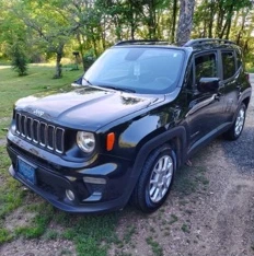 Blue Jeep photographed outdoors after detailing.